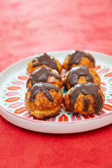 Profiterole with vanilla and chocolate sauce