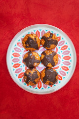 Profiterole with vanilla and chocolate sauce