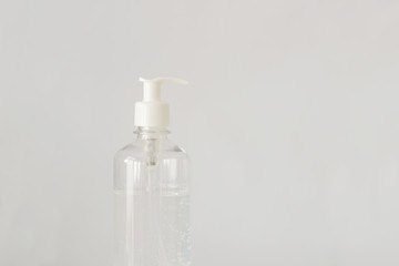 Plastic bottle pump with alcohol gel on the table with copy space. For cleaning hand and clear bacteria for stop corona virus outbreak. Protection against the virus, Covid 19, coronavirus 2019.