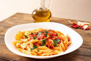Penne pasta with tomato sauce. Traditional Italian dish, pasta with chili sauce. Italian food.