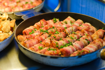Prawn wrapped with bacon and rosemary. baked appetizer. Close-up shot.