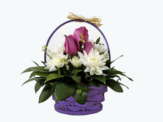 Bunch of flowers arrangement  in basket on white background