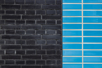 Two colored (grey and blue) brick wall