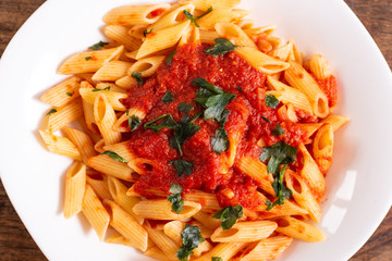 Penne pasta with tomato sauce. Traditional Italian dish, pasta with chili sauce. Italian food.