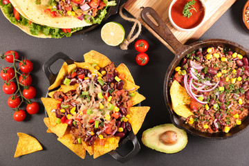 assorted of mexican dishes- fajita, nachos, chili con carne