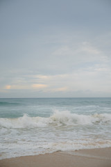 The coast of the Indian Ocean at dawn in Sri Lanka in March 2020. Calm beautiful water and azure blue waves