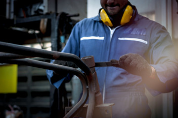 Industrial engineer worker working at manufacturing plant factory, young man working in industry