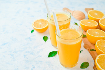 freshly squeezed orange juice and slices of orange fruit