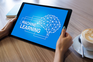 Machine learning, artificial intelligence and smart technology concept on device screen.