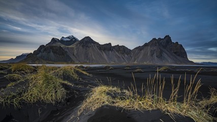 View of the mountain from the beach with black sand, Iceland