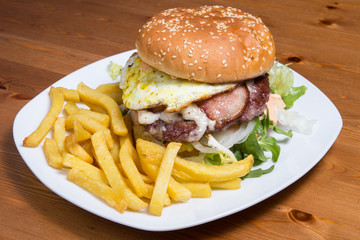 Appetizing burger with fried egg