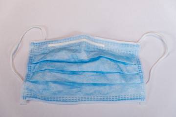 Surgical face mask on white background