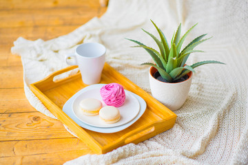 still life baked macaroons in a wooden tray