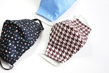 Many cotton face mask  against dust and virus  top view. Coronavirus preventive  cotton mask. 