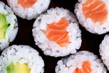 Sushi maki with salmon and avocado. Top view. © vitals