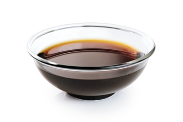 Bowl with soy sauce isolated on a white background.