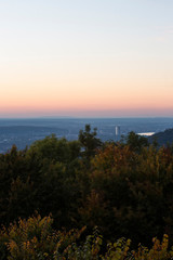 Fototapeta na wymiar Skyline over the Rhine into a German low mountain range at sunset