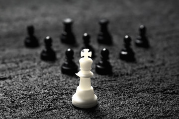 leading person in the form of a white figure behind him a crowd of black social leader on black...