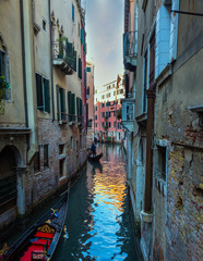 Fototapeta na wymiar Gondola ride along the Venetian canals