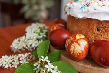 Easter symbols food - Easter cake and painted eggs. Easter orthodox sweet bread, kulich and colorful quail eggs. Holidays breakfast concept. Traditional orthodox christian easter food.