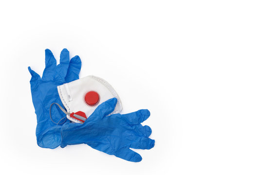 Protective gloves with a face mask on the white background and copy space