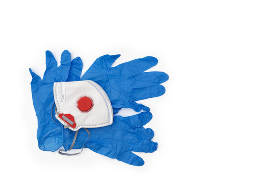 Protective gloves with a face mask on the white background and copy space