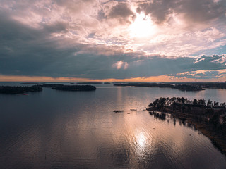 Helsinki islands. Scandinavian sea landscape. Beautiful sunset with reflection of clouds in the sea Aerial top down drone shot.