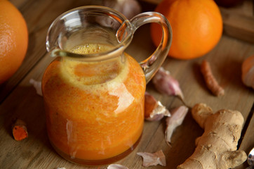 Homemade drink for cold and flu in a glass jug