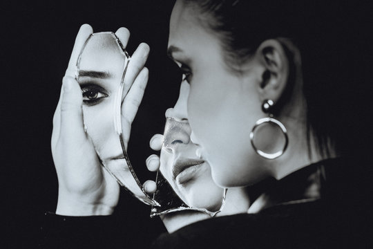 Perfect Woman Looking At Broken Mirror On Black Background, Black And White Portrait