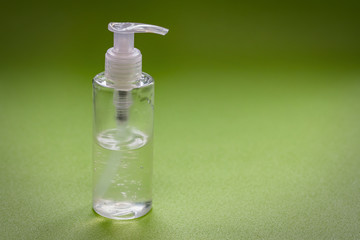 gel hand sanitizer gel cleaners to fight bacteria and viruses on a green background