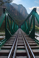 Green railway bridge along the Salkantay Trek near Aguas Calientes, Peru