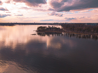 Helsinki islands. Scandinavian sea landscape. Beautiful sunset with reflection of clouds in the sea Aerial top down drone shot.