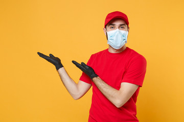 Delivery man in red cap blank t-shirt uniform sterile face mask gloves isolated on yellow...