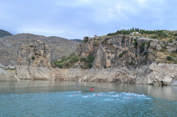Triathletes swimming in a lake in a triathlon trial, Canales, Spain