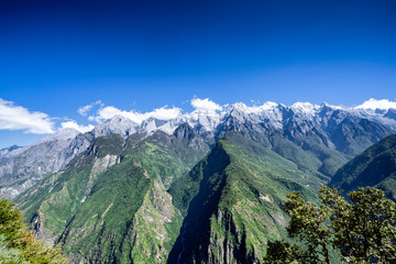 Panoramic top view of the Jade Dragon Snow Mountain on the hiking trails of the Tiger Leaping Gorge, Lijiang Yunnan, China