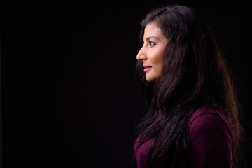 Closeup profile view of young beautiful Indian woman