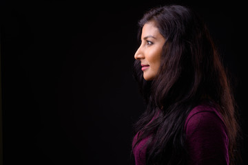 Fototapeta premium Closeup profile view of young beautiful Indian woman