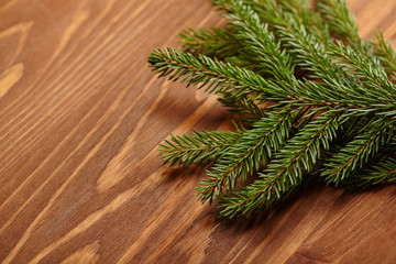 Naklejka premium New Year concept - Christmas tree on the wooden background
