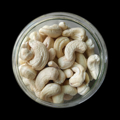 cashew nuts in a bowl isolated from black background vignettes frame pattern wallpaper, food photography