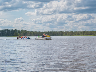 Landscape of harsh Karelian nature with kayak in lake. Active extreme ecotourism in Karelia. Water rafting in North lakes