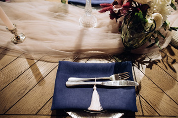 Wedding  dinner table setting  with silver knife and fork