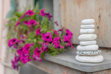 Obraz na płótnie Canvas Zen stone in flower garden. Natural background