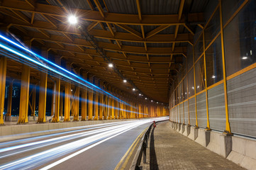 light trails and head lights of traffic in tunnel. Transportation background