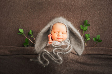 Newborn with rabbit ears. Spring photograph of a Newborn baby close-up and copy space.