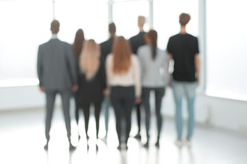 rear view. blurry image of a group of young business people