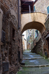 Fototapeta na wymiar The narrow streets amidst stone walls
