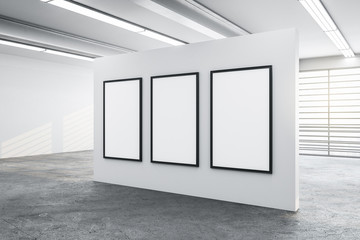 Three blank big mock up poster on white wall