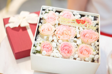 Close up many pink rose in the red gift box with ribbon for flower background or texture - Happy valentine's day concept.
