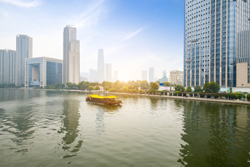 Fototapeta na wymiar Luxury cruise ships sailing on the Haihe River, Tianjin, China