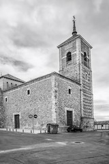 Fototapeta na wymiar Tower of the Church of Santiago Apostol, in Noblejas, Spain. Built in the 17th century in Herrerian style.